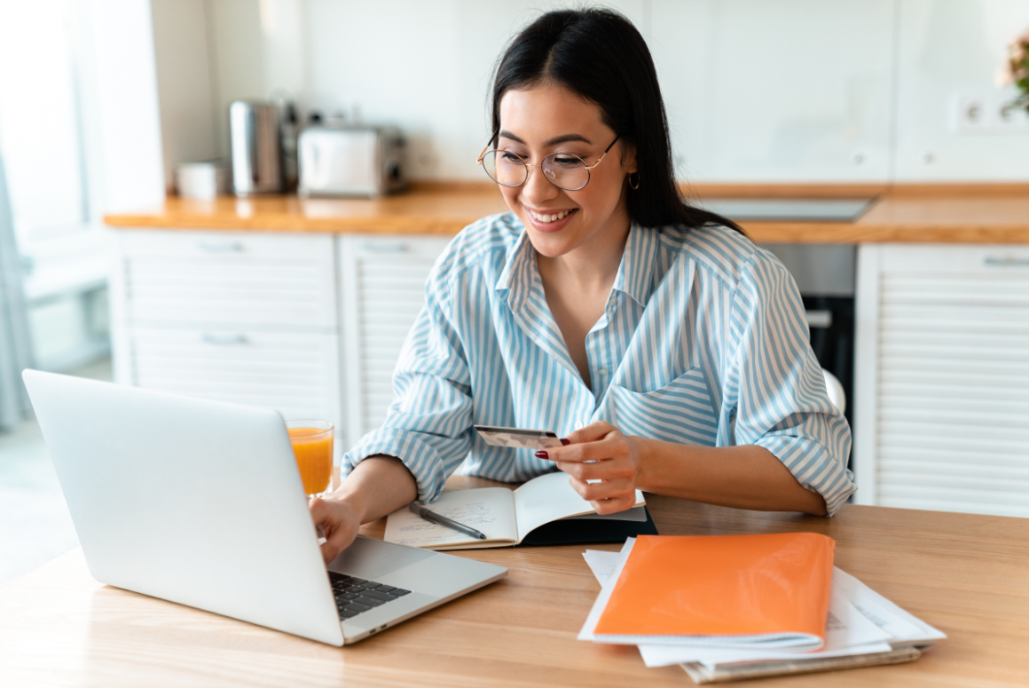 Woman using uChoose Rewards while online shopping with her Generations Bank debit card